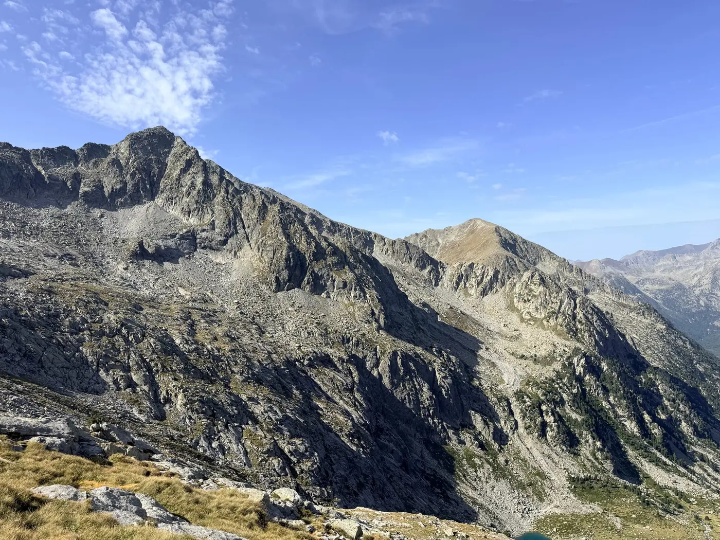 A rocky high-Pyrenees ridgeline above the cirque.